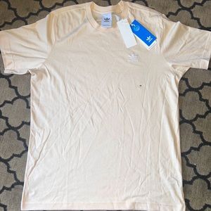 Men’s Adidas medium shirt, never worn. Still has tags